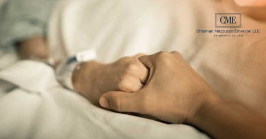 Person in the hospital holding someone else's hand